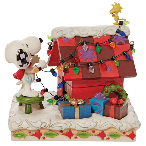 Santa Snoopy and Woodstock Decorating the Dog House